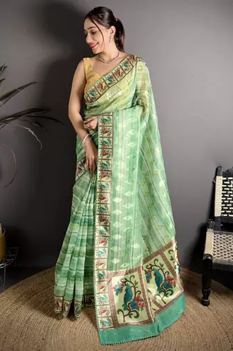 green slub cotton blend printed saree with unstitched blouse piece.