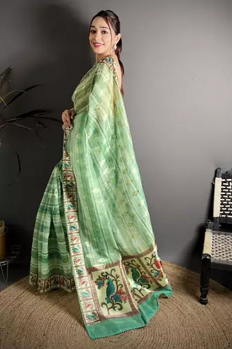 green slub cotton blend printed saree with unstitched blouse piece.