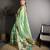 green slub cotton blend printed saree with unstitched blouse piece.