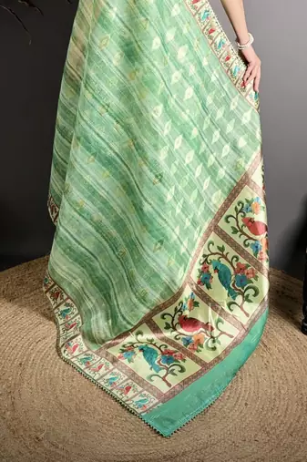 green slub cotton blend printed saree with unstitched blouse piece.