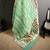 green slub cotton blend printed saree with unstitched blouse piece.