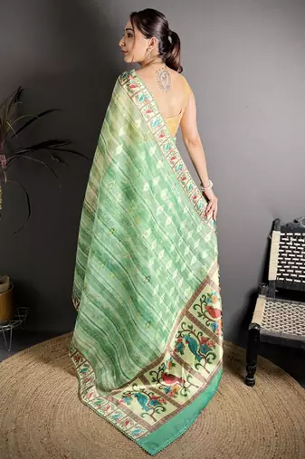 green slub cotton blend printed saree with unstitched blouse piece.