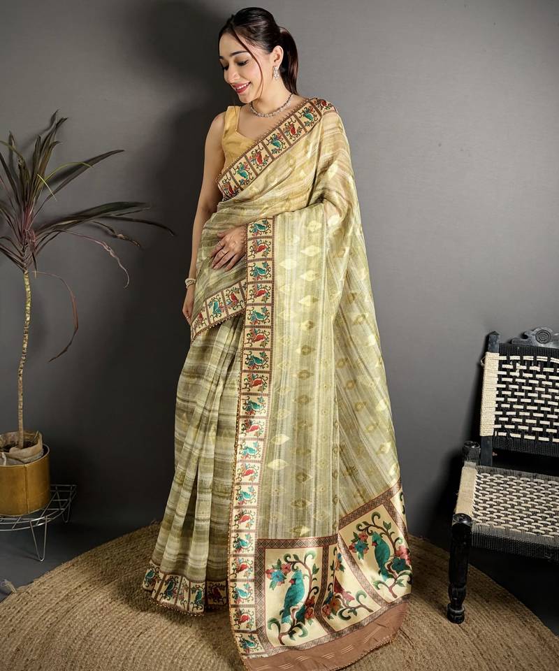 olive slub cotton blend printed saree with unstitched blouse piece.