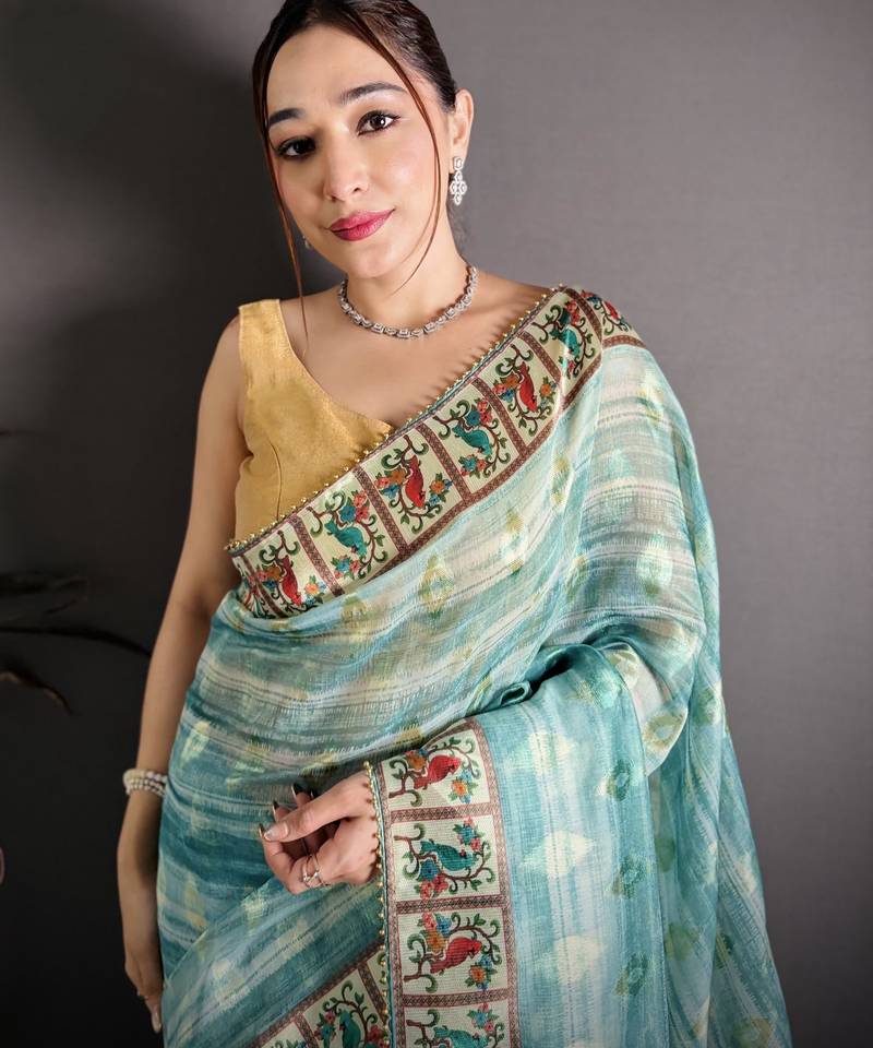 sky blue slub cotton blend printed saree with unstitched blouse piece.