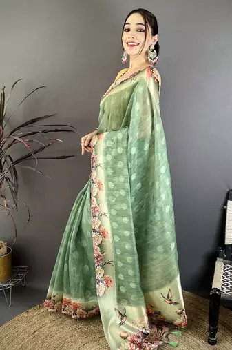green premium cotton blend printed saree with unstitched blouse piece.