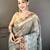 grey premium cotton blend printed saree with unstitched blouse piece.