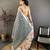 grey premium cotton blend printed saree with unstitched blouse piece.