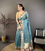 teal premium cotton blend printed saree with unstitched blouse piece.