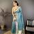 teal premium cotton blend printed saree with unstitched blouse piece.
