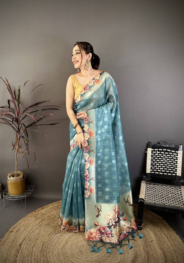 teal premium cotton blend printed saree with unstitched blouse piece.