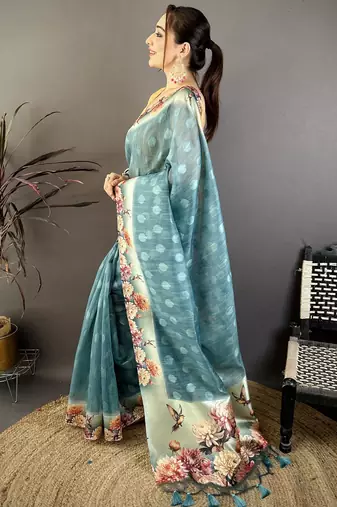 teal premium cotton blend printed saree with unstitched blouse piece.