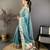 teal premium cotton blend printed saree with unstitched blouse piece.