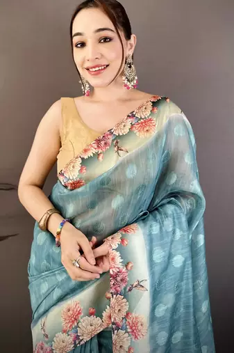 teal premium cotton blend printed saree with unstitched blouse piece.