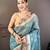 teal premium cotton blend printed saree with unstitched blouse piece.