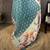 teal premium cotton blend printed saree with unstitched blouse piece.