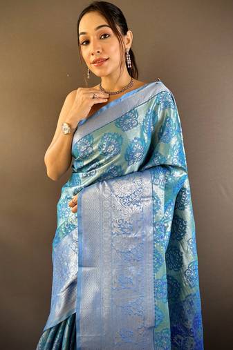 teal tissue silk blend kanjeevaram zari woven saree with unstitched blouse piece.
