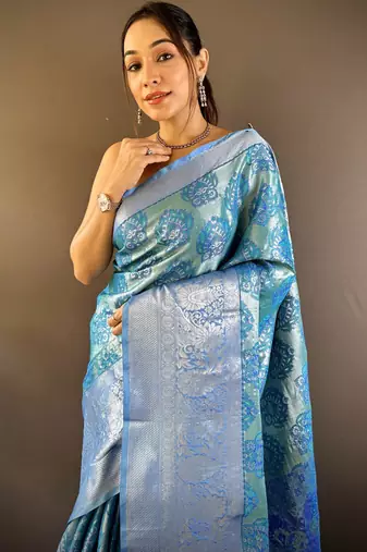 teal tissue silk blend kanjeevaram zari woven saree with unstitched blouse piece.