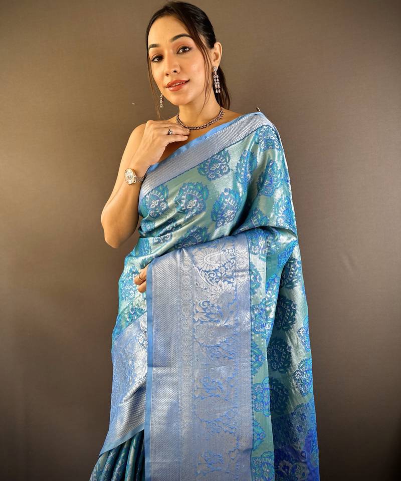 teal tissue silk blend kanjeevaram zari woven saree with unstitched blouse piece.
