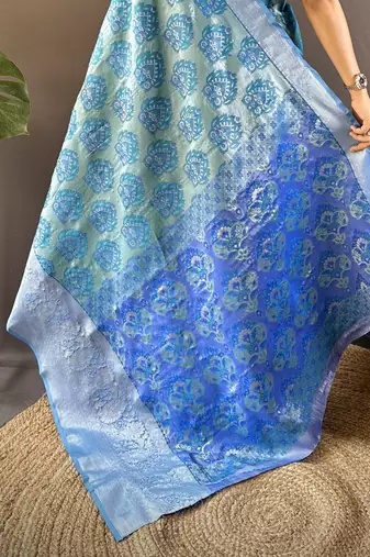teal tissue silk blend kanjeevaram zari woven saree with unstitched blouse piece.