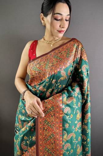 green satin silk blend zari woven saree with unstitched blouse piece.