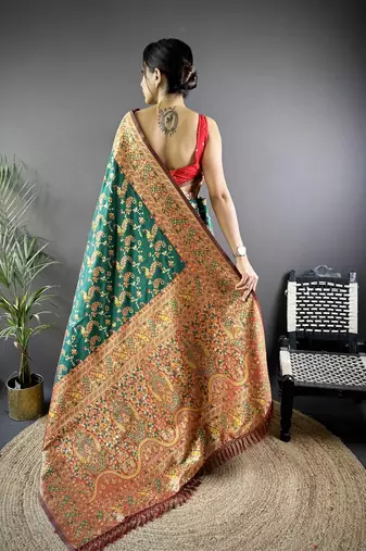 green satin silk blend zari woven saree with unstitched blouse piece.