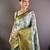 grey tissue silk blend kanjeevaram zari woven saree with unstitched blouse piece.