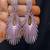 Sparkling fuchsia sunburst statement earrings | rhodium plated chandelier earrings