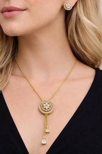 Gold crystal pendant necklace and tassel earrings set