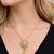 Gold crystal pendant necklace and tassel earrings set