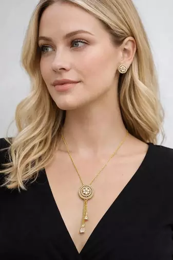 Gold crystal pendant necklace and tassel earrings set