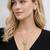 Gold crystal pendant necklace and tassel earrings set