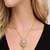 Gold crystal pendant necklace and tassel earrings set