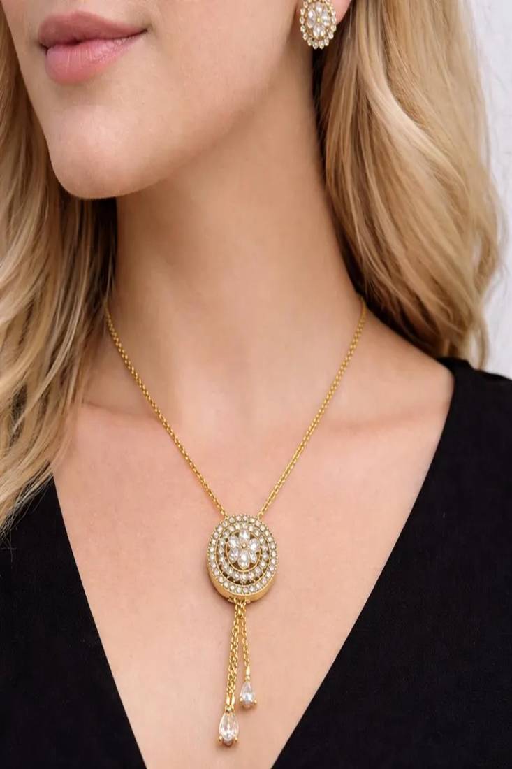 Gold crystal pendant necklace and tassel earrings set