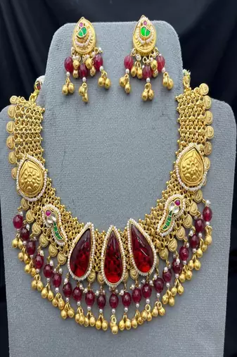 Antique gold kundan choker necklace set with ruby red stones