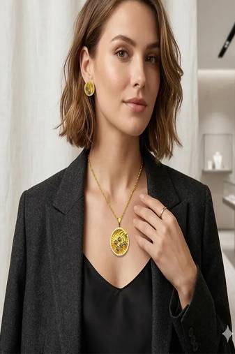 Gold plated sunburst jewelry set: floral pendant necklace, black stone earrings