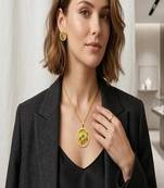 Gold plated sunburst jewelry set: floral pendant necklace, black stone earrings