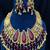 Antique gold kundan choker necklace set with ruby red stones