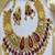 Antique gold kundan choker necklace set with ruby red stones