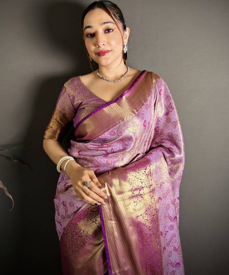 lavender kanjeevaram silk blend zari woven saree with unstitched blouse piece.