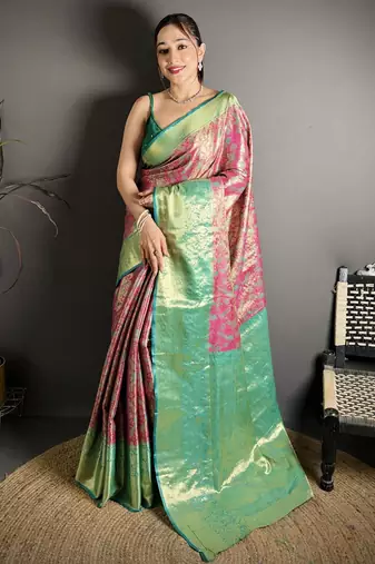 rust kanjeevaram silk blend zari woven saree with unstitched blouse piece.