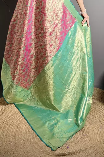 rust kanjeevaram silk blend zari woven saree with unstitched blouse piece.