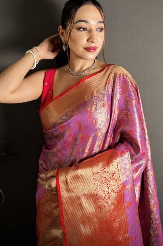 pink kanjeevaram silk blend zari woven saree with unstitched blouse piece.