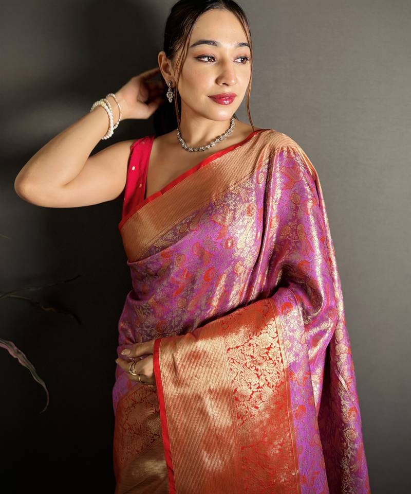 pink kanjeevaram silk blend zari woven saree with unstitched blouse piece.
