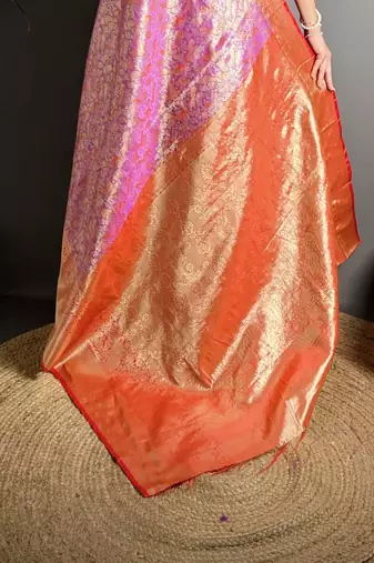 pink kanjeevaram silk blend zari woven saree with unstitched blouse piece.