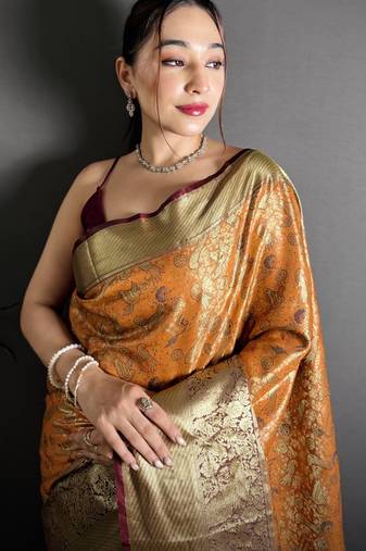 orange kanjeevaram silk blend zari woven saree with unstitched blouse piece.