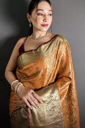 orange kanjeevaram silk blend zari woven saree with unstitched blouse piece.