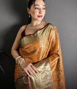orange kanjeevaram silk blend zari woven saree with unstitched blouse piece.