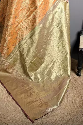orange kanjeevaram silk blend zari woven saree with unstitched blouse piece.