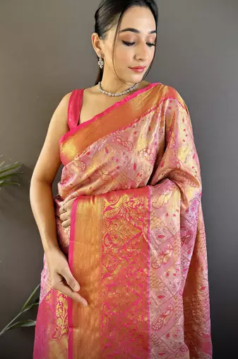 pink silk blend blend zari woven saree with unstitched blouse piece.