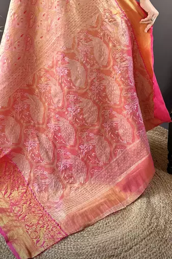 pink silk blend blend zari woven saree with unstitched blouse piece.